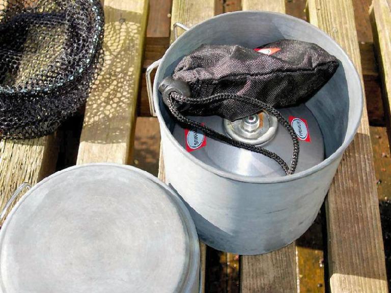 The stove is stowed away in its cooking pot.