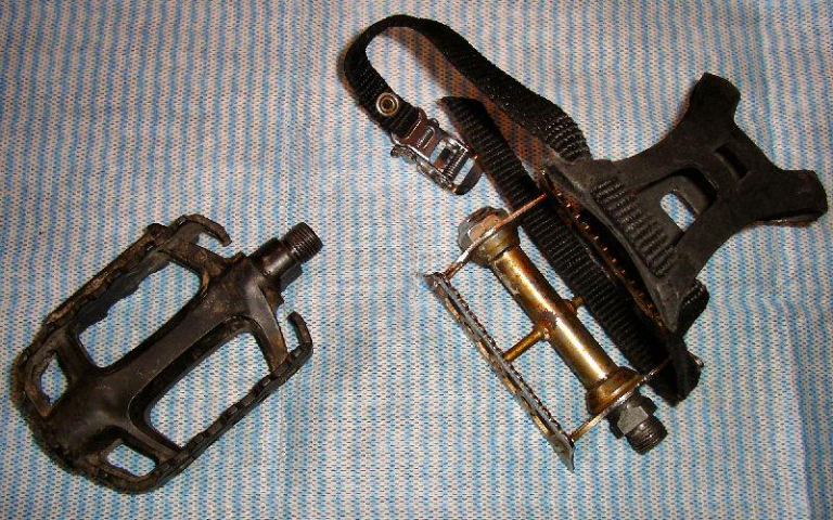Platform pedal on the left and an old pedal with straps on the right.