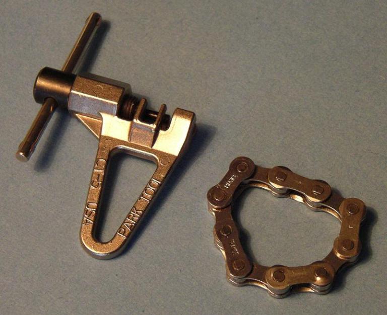 This is a picture of a Park Chain tool and a length of practice chain.